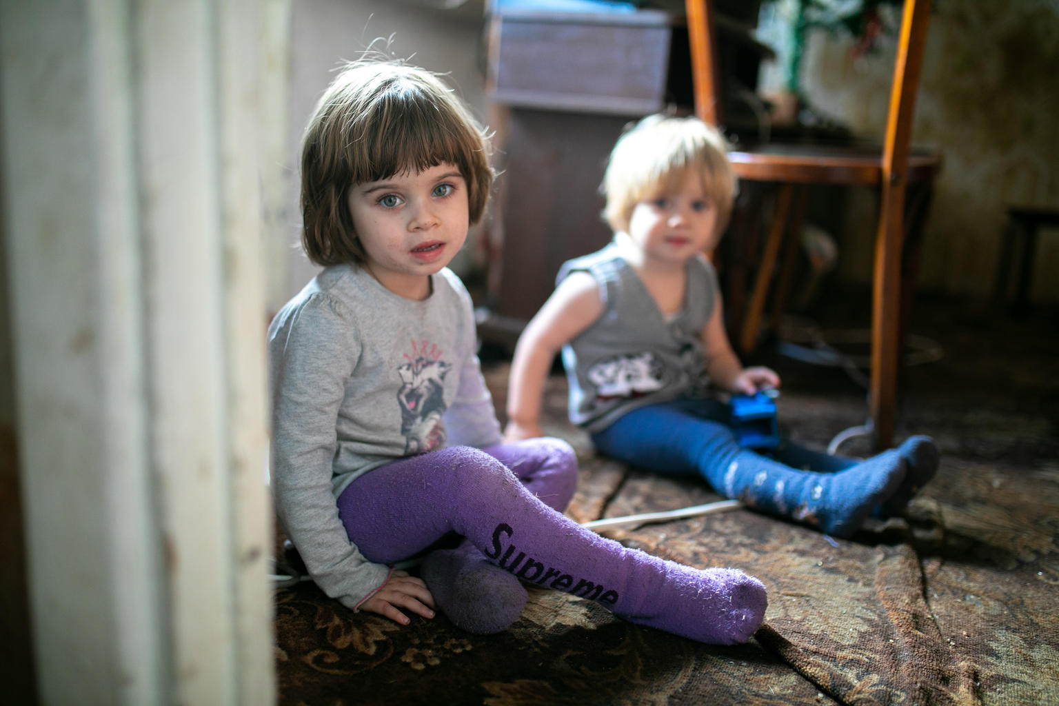 Liza 3 y.o. plays with his younger brother in their home in Krasnohorivka, which is close to the front line.